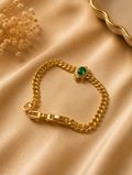 Gold Cuban Chain Bracelet with Emerald Sun Charm