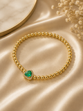 Gold Bead Stretch Bracelet with Emerald Heart Crystal